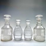 A pair of Georgian glass decanters and stoppers, with hobnail and spiral fluted decoration, height