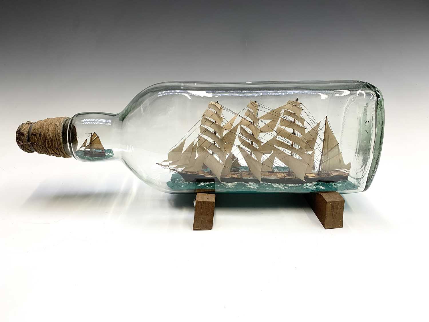Mark Penrose, a large model ship in bottle, with a four master schooner, with a further fishing boat