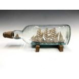 Mark Penrose, a large model ship in bottle, with a four master schooner, with a further fishing boat