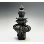 An elaborately carved wooden finial. Height 30cm.Condition report: 6.5cm rounded square at its base,
