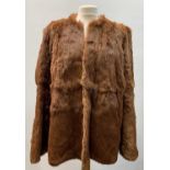 A 1950s mink stole, together with a coney fur coat in an auburn shade, the latter labelled 'Daphmond