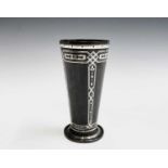 A copper vase, circa 1900, with inlaid silver geometric and floral inlay on a pedestal foot,