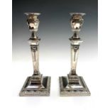 A pair of crested epns Adam's style candlesticks, early 20th century, height 28cm.