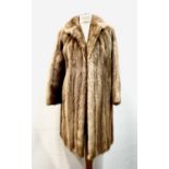 A ladies blonde mink mid length fur coat, approximate size 12.Condition report: Good vintage