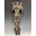 A late 19th century wall-mounted Sepik River figure, bearing traces of original paint. Height 82cm.