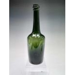 A late 18th century blown green glass bottle. Height 29.5cm.Condition report: No obvious cracks