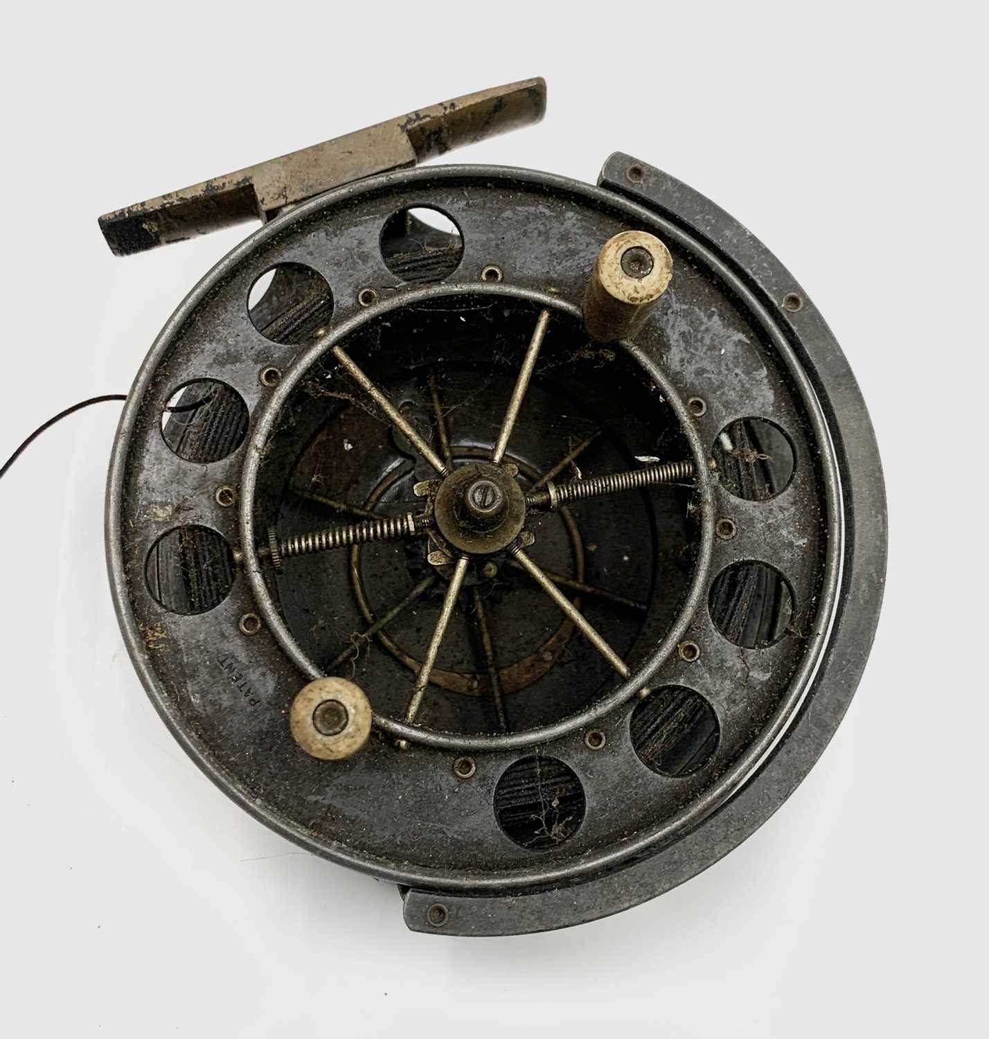 An Allcock & Co centre pin Aerial fishing reel, with ivorine handles and brass foot, diameter