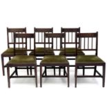 A set of six George III mahogany dining chairs, the bar backs with ebony stringing, drop-in seats on