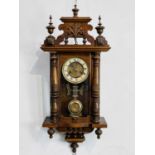 An early 20th century Hamburg American Clock Company (HAC) beech and walnut spring driven 8 day wall