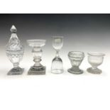 A 19th century glass double spirit measure, height 13.8cm, together with two Georgian glass salts,