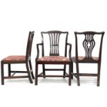 A set of six Georgian mahogany dining chairs with pierced splats, together with a similar elbow