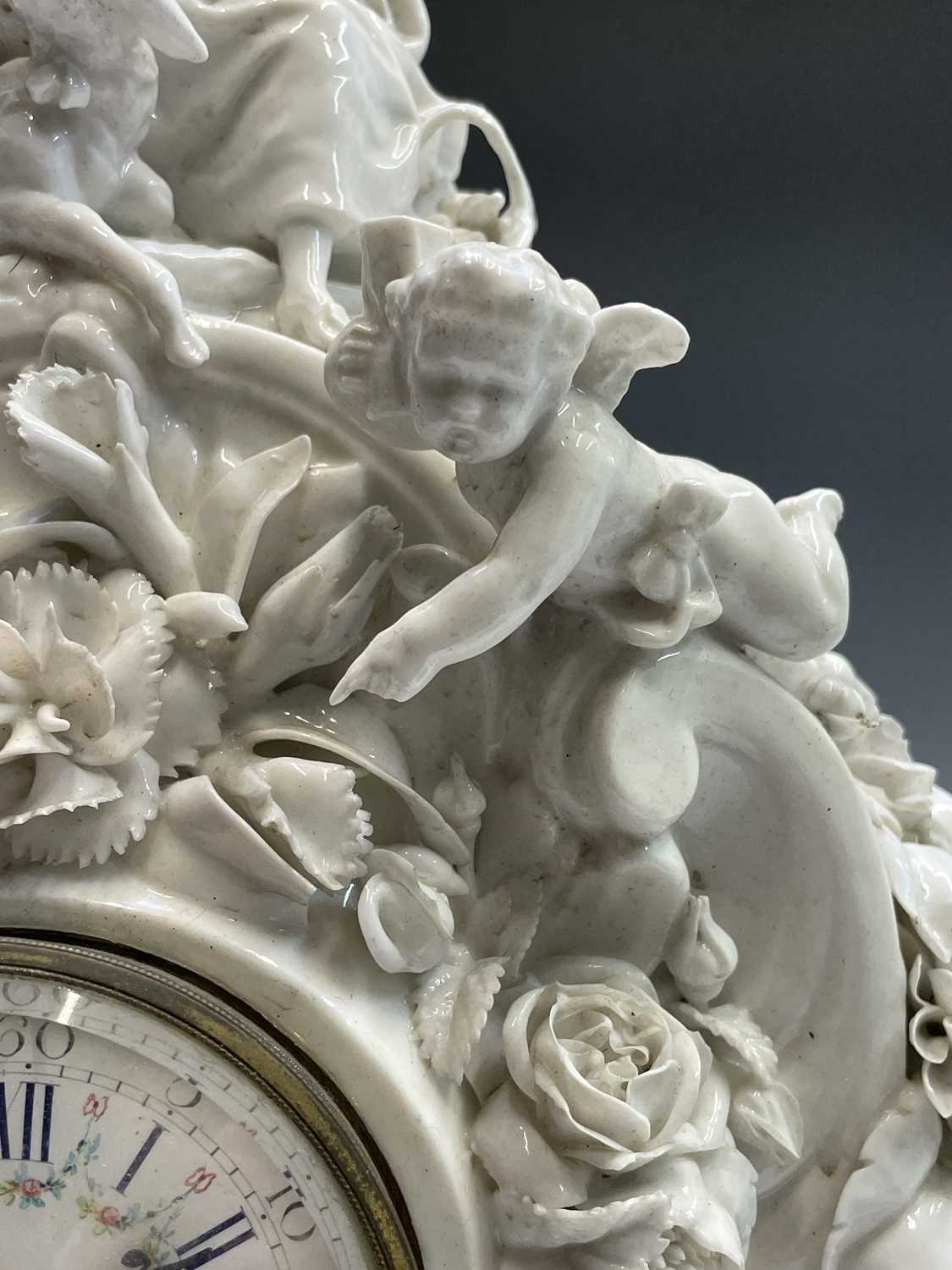 A 19th century French porcelain cased mantel clock by Vion & Baury, surmounted by a shepherdess, - Image 7 of 13