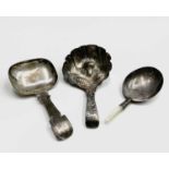 A silver caddy spoon by Ledsam, Vale & Wheeler Birmingham 1827, another with fruit to the bowl (