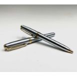 A Sheaffer brushed chrome gold trim fountain pen and matching ball-point