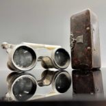 A papier-mache snuff box dated 1858 to a silver escutcheon 9cm long and a pair of aluminium and