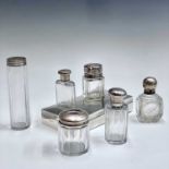 A small Edwardian cut glass flask with silver lid, an Edwardian Chester marked glass salts jat