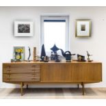 An Archie Shine for Robert Heritage teak and rosewood veneered sideboard, fitted with four reeded