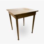 A Heal's Arts & Crafts oak square section side table, raised on circular turned legs with pad