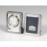 A silver mounted rectangular photograph frame 6cm, a ditto timepiece 6cm