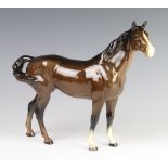 A Beswick figure of a swish tail horse H1182 gloss, modelled by Arthur Greddington 22.2cm