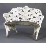 A Coalbrookdale style cast iron fern and blackberry pattern garden seat with wooden slatted seat,