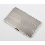 A silver engine turned cigarette case Birmingham 1940, 215 grams