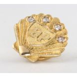A 9ct yellow gold "BP" shell shaped diamond set pin 4.3 grams