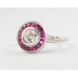 A platinum and mine cut diamond and ruby Art Deco style ring, diamond approx. 0.5ct, surrounded by
