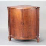 A 19th Century Continental mahogany bow front corner cabinet with canted and fluted corners 82cm h x