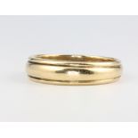 An 18ct yellow gold wedding band size X, 7.4 grams