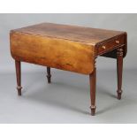 A Victorian mahogany Pembroke table fitted a drawer and raised on turned supports 70cm h x 104cm w x