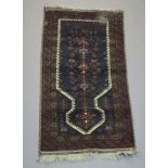 A red, white and blue ground Afghan prayer rug 142cm x 72cm Some signs of old moth and fringing is