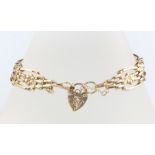 A 9ct yellow gold bracelet with heart padlock 18cm, 6.2 grams