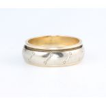 A 9ct yellow gold spinning ring, size N 1/2, 5.8 grams