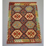 A yellow turquoise and green ground Chobi Kilim 128cm x 80cm