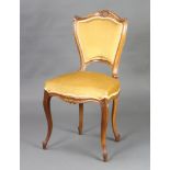 A 19th Century French carved walnut show frame chair, the seat and back upholstered in mushroom