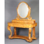 A Victorian bleached mahogany Duchess dressing table with oval bevelled plate mirror, the base