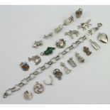 A collection of silver charms 44 grams