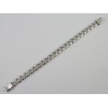 A silver curb link bracelet 64 grams