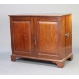 A 19th Century mahogany press cabinet, interior fitted 3 trays enclosed by panelled doors, brass