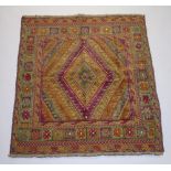 A brown and plum ground Gazak rug 127cm x 110cm