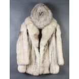 A lady's white quarter length fur coat together with matching hat