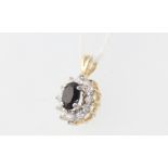 A 9ct yellow gold blue sapphire and paste pendant 1.2 grams, 10mm