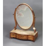 A 19th Century oval plate dressing table mirror contained in an inlaid mahogany frame the base of