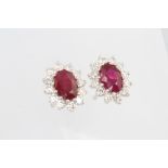 A pair of 18ct white gold oval ruby and diamond ear studs, rubies approx. 1.93ct, the brilliant