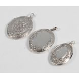 Three silver lockets