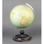 A Philips 9" terrestrial globe raised on an ebonised baseSome staining to the papers