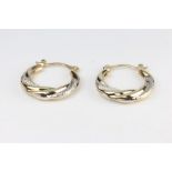 A pair of 9ct two colour gold hoop earrings 1.5 grams