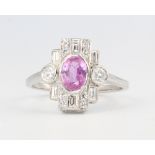 A platinum Edwardian style oval pink sapphire and diamond cocktail ring, size 0 1/2, 4.7 grams