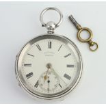 A Victorian silver keywind pocket watch with seconds at 6 o'clock, the dial inscribed Thos Yates